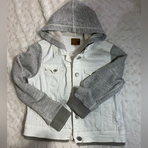 Cropped white denim hooded jacket with grey sweatshirt sleeves and hood.
